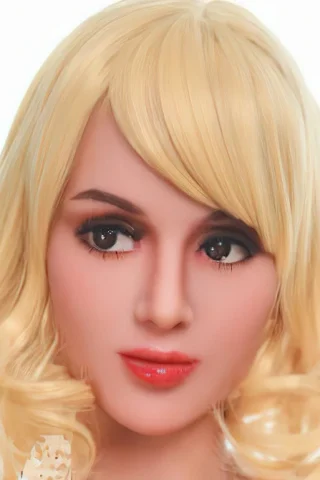 Blonde doll with curly hair and realistic facial features, wearing subtle makeup and a neutral expression.