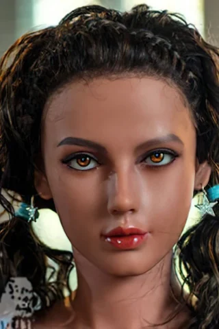 Doll with brown hair and amber eyes, wearing a blue top, posed with a neutral expression.