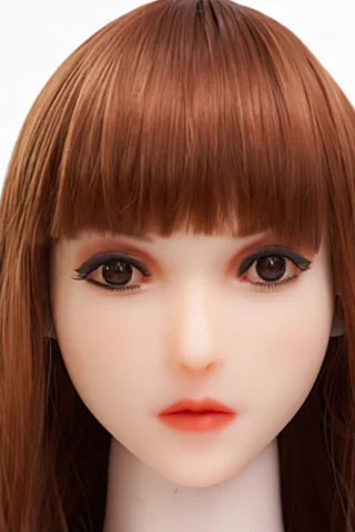 Doll head with long brown hair and straight bangs, featuring detailed makeup and realistic eyes.