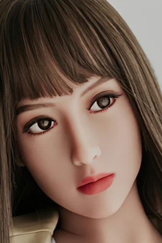 Doll 160cm with long brown hair, wearing a neutral expression and light makeup, against a plain background.