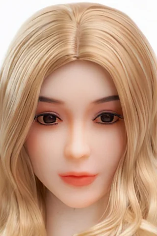 Doll head with long blonde hair and soft facial features, displaying detailed makeup and a neutral expression.