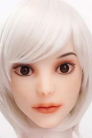 Doll head with short white hair, large brown eyes, and natural-looking lips against a plain background.