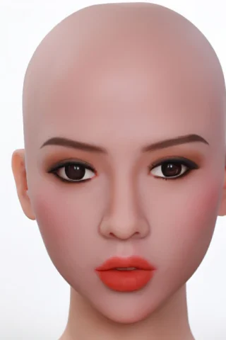 Bald doll head with realistic facial features, featuring dark eyes and coral lips against a plain background.