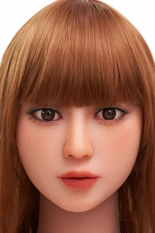 Doll head with long brown hair, brown eyes, and natural makeup, set against a plain white background.