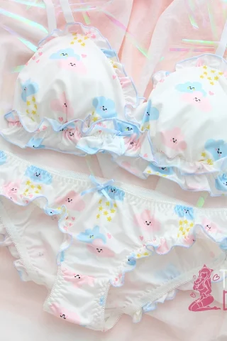 Cute Smiling Cloud Bikini features a pastel design with clouds and stars, ruffled edges, and a soft color palette.