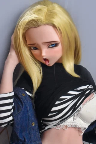Android 18 doll 148cm with blonde hair, wearing a black and white striped top and denim jeans, posed playfully.