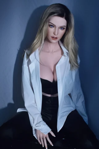 Tyler Grande 165cm doll wearing a white shirt over a black bra, seated with long blonde hair and blue eyes.