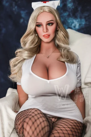 Elsie 156cm M Cup WM Doll wearing a white nurse outfit with fishnet stockings, seated with long blonde hair and a headband.