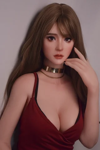 Eguchi Masami 165cm wearing a red top, with long brown hair and a gold choker, posing with a hand near her face.