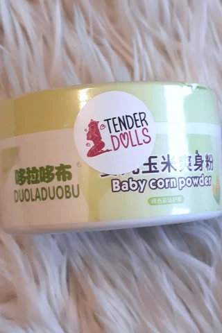 Baby Corn Powder container with a light green label featuring the product name and a logo sticker.