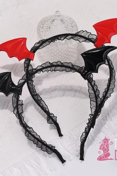 Two Evil Bat headbands with bat wings, one red and one black, on a white lace surface.