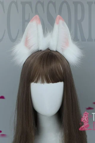 Majestic High Fox ears, featuring white fur with pink accents, attached to a headband worn by a mannequin with long brown hair.