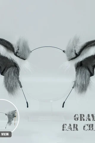 Posable Majestic Anime Ears feature gray faux fur with silver chains and cross charms, displayed on a clear headband.