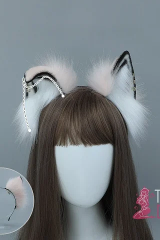 Posable Antique Fox ears with pink and white fur, featuring decorative chains, displayed on a wig mannequin.