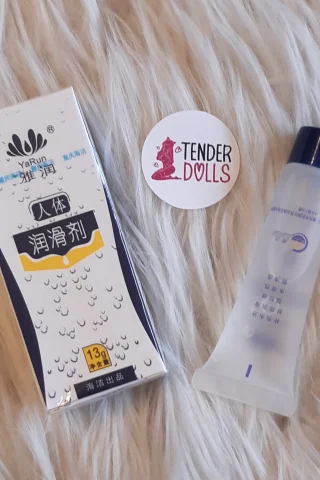 Water Based Lubricant 52g four packs displayed with a tube and branded sticker on a fluffy surface.