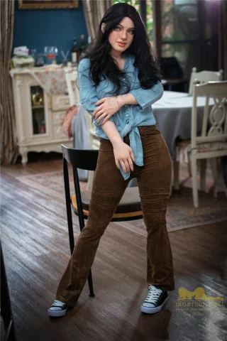 Ivy S27 152cm stands in a casual pose, wearing a light blue button-up shirt and brown corduroy pants with sneakers.