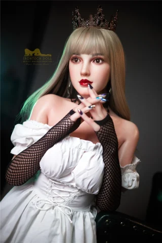 153cm Cherry S9 Irontech Sex Doll wearing a white off-shoulder dress and black fishnet gloves, with long blonde hair and a crown.