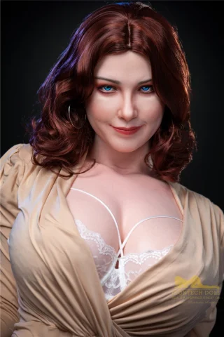 Carmel S12 160cm Irontech doll with wavy brown hair, blue eyes, and wearing a beige top revealing lace details.