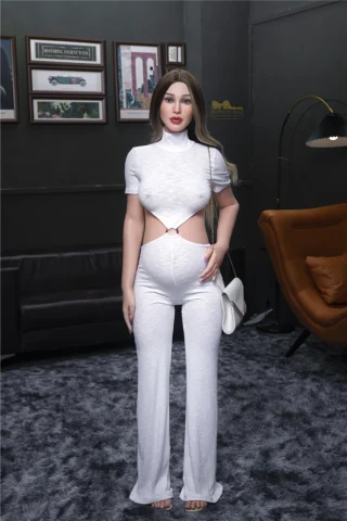 Pearl S19 158cm pregnant Irontech sex doll wearing a white cutout jumpsuit, holding a white handbag in a modern living room setting.