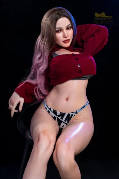 S13 Celine 165cm realistic sex doll by Irontech with long hair and red shirt posing on a stool