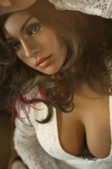 Close-up of a woman with long dark hair in a white lace top, resembling an XNX Gisele X8 164cm Doll, gazing upward