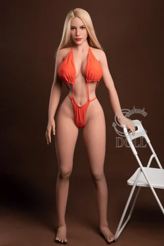Doris 161cm F Cup stands in an orange bikini, with long blonde hair and a neutral background.