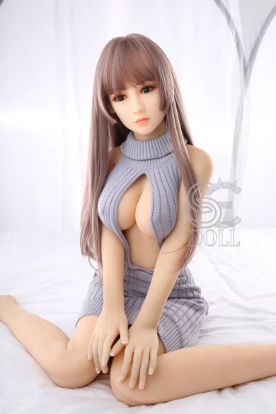 Randi 151cm E Cup #012 SE Doll with long hair in revealing gray outfit on white bed