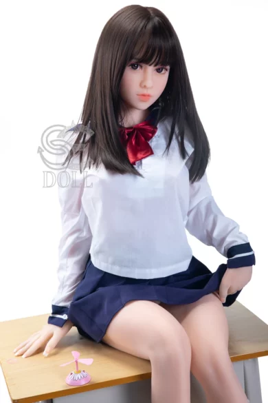 Aki 151cm E Cup SED137 love doll seated on wooden surface in white blouse, red bow tie, navy skirt