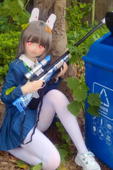 Hinata 150cm B Cup #78 Head wearing school uniform and rabbit-eared headband poses playfully with toy gun beside recycling bin outdoors evoking whimsical love doll aesthetic