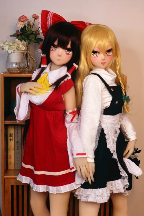 Eiko 155cm B Cup doll with #60 and #61 heads wearing intricate anime-style costumes; one in red and white, the other in dark and white, showcasing love doll allure.