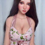 Mizushima Suzuran 165cm sex doll with long dark hair in a floral dress against a light background