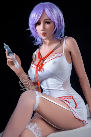 Monica 168cm F Cup #077 SE Doll wearing a white nurse outfit with red accents, holding a syringe, and sitting with a playful expression.