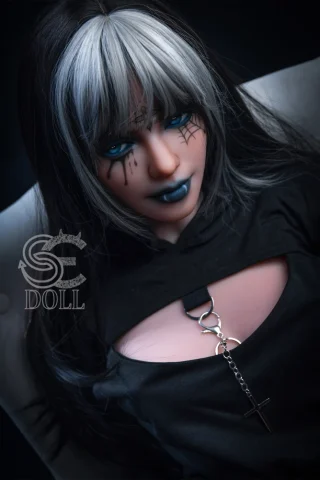 Heloise 166cm B Cup doll with black and silver hair, wearing a dark outfit and striking blue makeup.