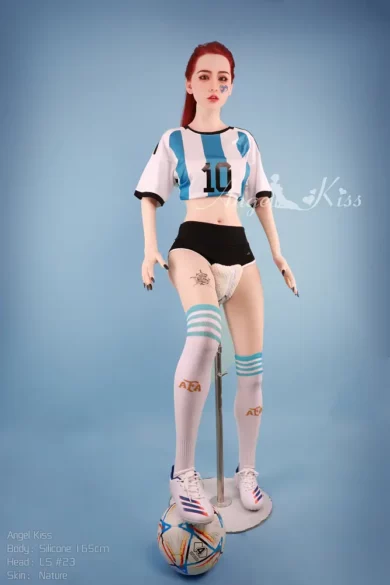 AK165 #LS23 Silicone Angel Kiss doll posed with soccer ball against blue background in stylish soccer uniform and striped socks