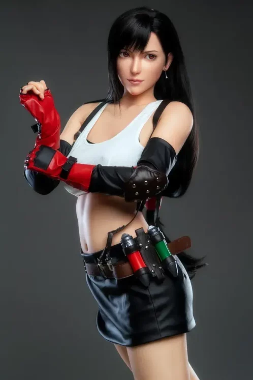 Lady.15 sex doll dressed in a white top, black skirt, and red gloves against a grey backdrop