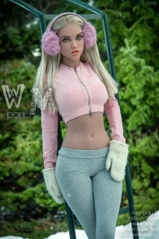 WM Doll 159cm C Cup #398 Head stands outdoors wearing a pink cropped jacket, gray leggings, and white mittens with pink earmuffs.