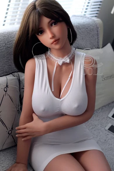 Elanie 161cm F Cup SE L076 SE Doll in white gown seated on sofa in bright room