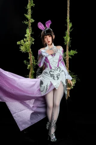 Astra GE108 155cm C Cup Zelex stands on a swing, wearing a purple and white outfit with bunny ears and thigh-high stockings.