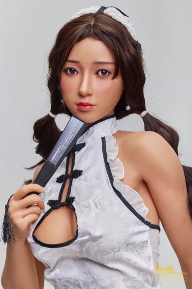 Tanned 168cm A Cup Irontech Love Doll in Chinese dress holding a fan near face.