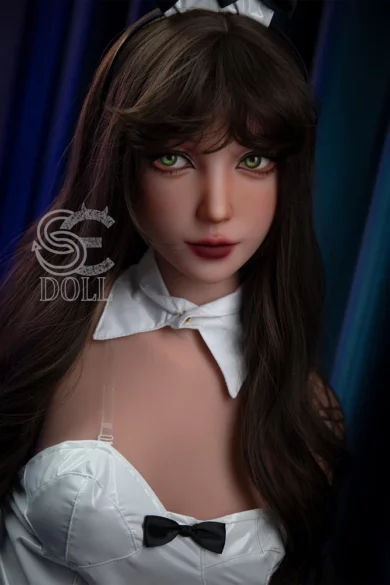 Charlene 166cm B Cup #121 SE Doll with long brown hair, green eyes, in a white outfit with a bow against a blue background