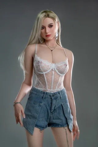 GE111 175cm E Cup Zelex features long blonde hair, wearing a white lace bodysuit and denim shorts, posed against a gray background.