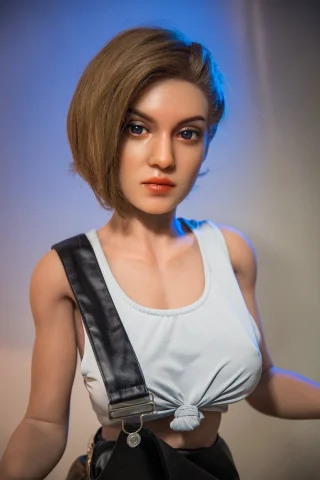 Judy 153cm features a short bob hairstyle, wearing a white tank top and black overalls, with a neutral expression.