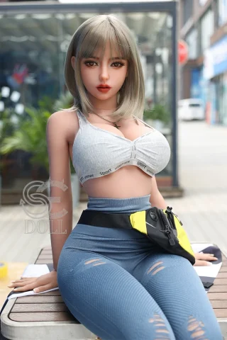 Melody.C 161cm F Cup doll in a gray sports bra and blue leggings, sitting outdoors with a fanny pack.