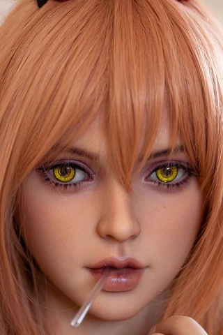 FWD070 doll with long, wavy light brown hair and striking yellow eyes, holding a straw in her mouth.