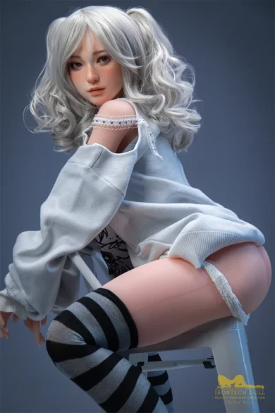 S10 154cm H Cup Irontech TPE sex doll with silver hair posed on a chair wearing a loose off-shoulder top and striped stockings