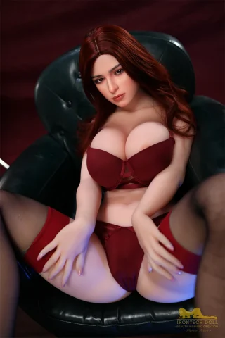 S38 161cm F Cup Irontech TPE Doll seated in a chair, wearing a burgundy lingerie set with stockings.