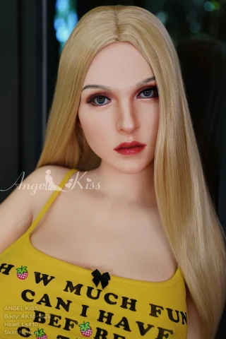 AK162 5ft5 Silicone Angel Kiss doll with long blonde hair, wearing a yellow top with text and a black bow.