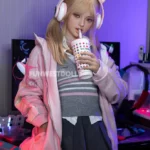 Figure styled in Alice #038 159cm A cup Natural outfit in tech-themed room, wearing pink jacket and cat ear headphones, sipping a drink through a straw