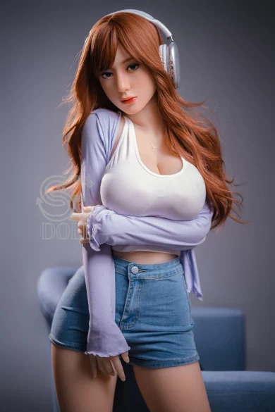 Sex doll with long brown hair, headphones, white top, lavender cardigan, and denim shorts