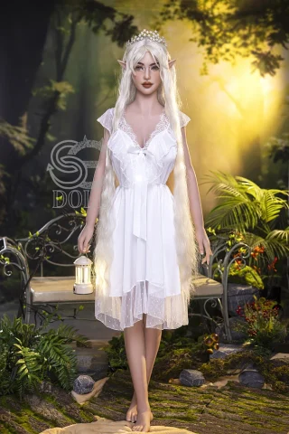 SED306 161cm F Cup Head #021 Luis stands in a white dress with lace details, holding a lantern in a lush, forested setting.